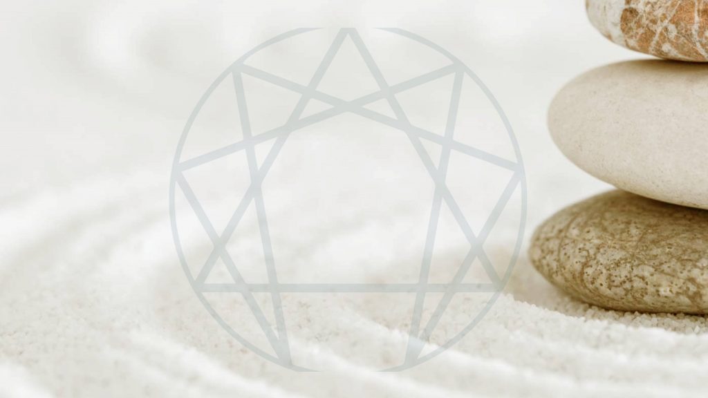eneagram symbol on white sand